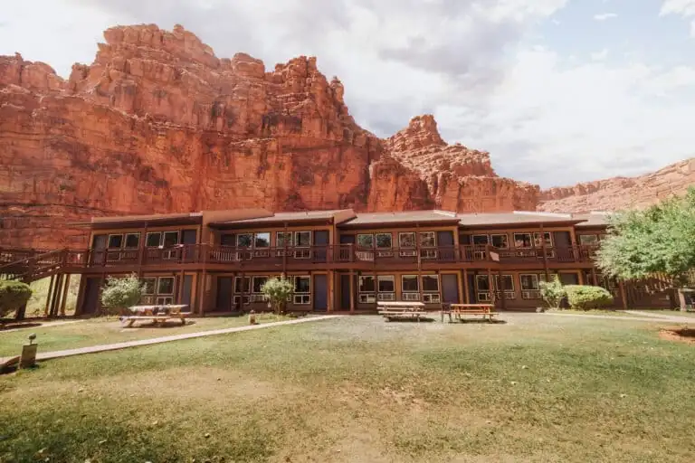The Havasupai Lodge, a two-story motel-style building with balconies beneath red canyon walls in Supai Village